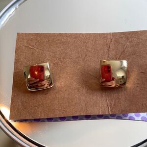 Two gold tone square tuxedo shirt studs